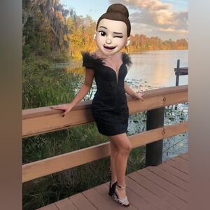 Stunning black formal dress with feathers and sparkles. Like new size 2.